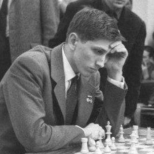 A photo of Bobby Fischer at a chess board. Credit: Ulrich Kohls. Image available through Creative Commons.