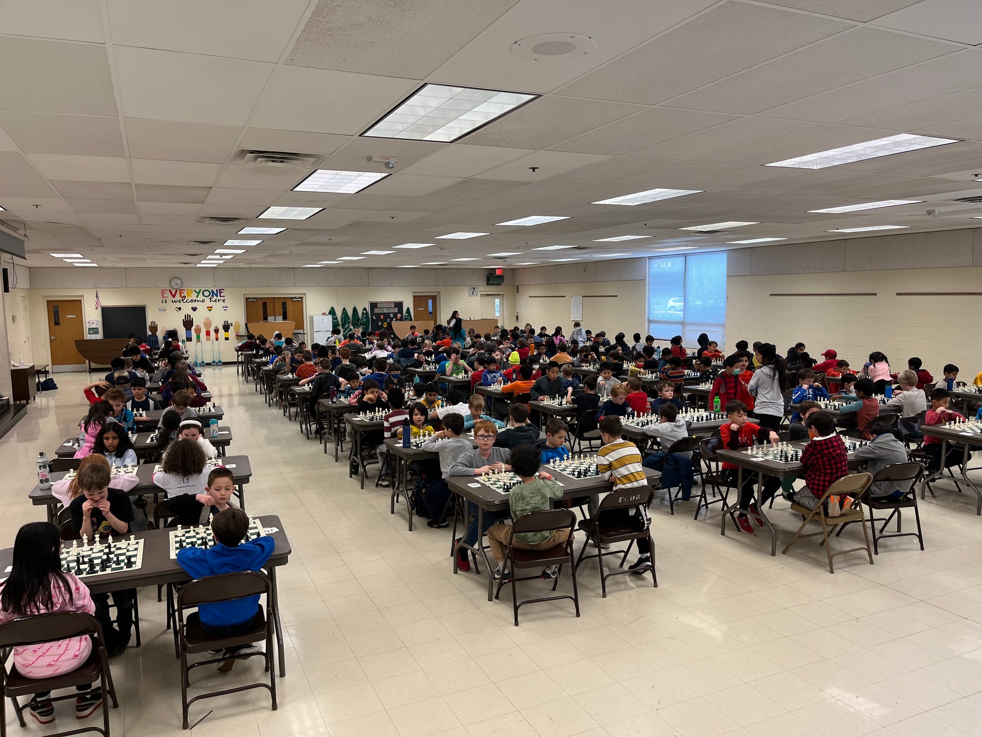 kids playing a chess tournament