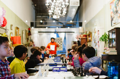 Chess teacher and kids