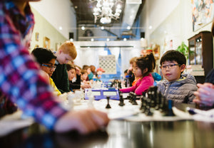 Little kids playing chess